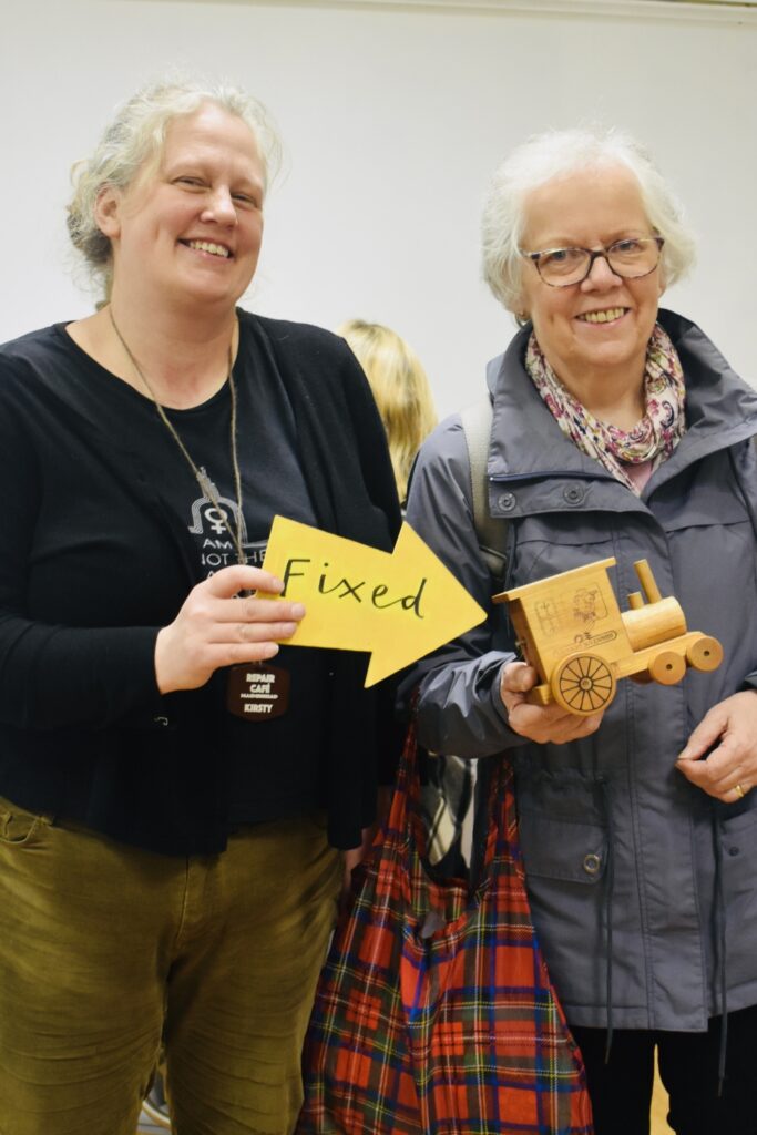 Two ladies with a fixed music box