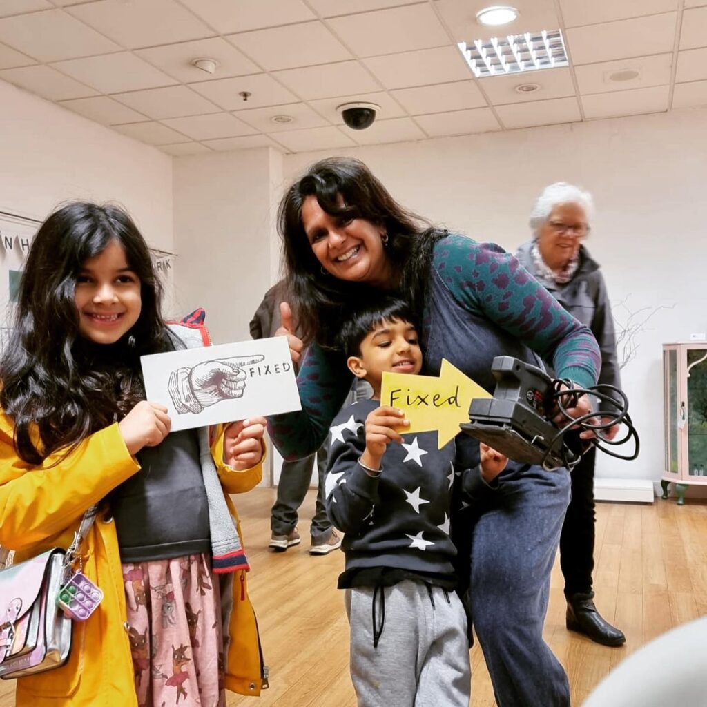 Two children and their mum with a repaired item